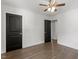 A bedroom with hardwood floors offers black interior doors and a ceiling fan at 1314 Hudson Ave, Durham, NC 27705