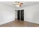Bedroom with fan, dark-stained flooring, and entry to closet or bathroom at 1314 Hudson Ave, Durham, NC 27705