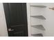 Walk-in closet featuring stylish shelves and dark door with nice hardware at 1314 Hudson Ave, Durham, NC 27705
