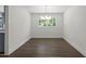 Bright and airy dining room featuring neutral decor, a modern chandelier, and hardwood floors at 1314 Hudson Ave, Durham, NC 27705