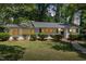 Exterior view of a charming single story home featuring a well-manicured lawn and welcoming entrance at 1314 Hudson Ave, Durham, NC 27705