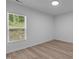 Bright bedroom featuring hard surface flooring and natural light at 1349 Crabtree Blvd, Raleigh, NC 27610