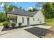 Charming single story home featuring manicured front yard and inviting covered porch at 1349 Crabtree Blvd, Raleigh, NC 27610