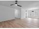 Bright living room with vinyl floors, ceiling fan and fresh white paint at 1349 Crabtree Blvd, Raleigh, NC 27610
