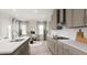 Bright kitchen with modern appliances, quartz countertops and adjacent dining area at 136 Fairport Ln, Apex, NC 27539