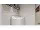 Functional laundry room with white washer and dryer, wire shelving for storage, and a clean, organized space at 136 Fairport Ln, Apex, NC 27539