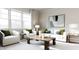 Comfortable living room with a large window, white sofas, and a wooden coffee table at 136 Fairport Ln, Apex, NC 27539