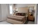 Comfortable main bedroom with neutral color palette, stylish lamps, and elegant side tables at 136 Fairport Ln, Apex, NC 27539