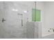 Bathroom featuring a frameless glass shower, soaking tub and elegant tile surround at 1408 South St, Durham, NC 27707