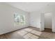 Bright bedroom with hardwood floors, closet and sun-filled windows at 1408 South St, Durham, NC 27707