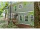 Exterior shot of the home's back porch and well-maintained landscaping at 1408 South St, Durham, NC 27707