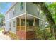 Two-story home with a back porch and mature trees surrounding at 1408 South St, Durham, NC 27707