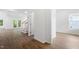 Spacious living room featuring wood floors, white walls, and bright natural light at 1408 South St, Durham, NC 27707