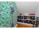 Attic space with a unique tropical themed accent wall and functional closet shelving perfect for storage at 1431 Courtland Dr, Raleigh, NC 27604