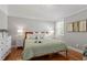 Cozy primary bedroom with hardwood floors and natural light at 1431 Courtland Dr, Raleigh, NC 27604