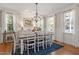 Bright dining room with ample seating, hardwood floors, and a seamless flow to the kitchen area at 1431 Courtland Dr, Raleigh, NC 27604