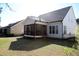 Backyard view of screened porch at 145 Plantation Dr, Youngsville, NC 27596
