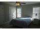 Inviting bedroom with natural light, carpet, ceiling fan and a double door closet at 145 Plantation Dr, Youngsville, NC 27596