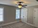 Well-lit bedroom featuring neutral paint, carpet, and ample closet space at 145 Plantation Dr, Youngsville, NC 27596