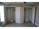 Bedroom with double closets, carpet, and neutral paint at 145 Plantation Dr, Youngsville, NC 27596
