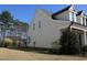 A well-maintained home with a manicured lawn and a partial view of the fenced backyard at 145 Plantation Dr, Youngsville, NC 27596