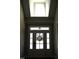 Bright foyer features a front door with sidelights and a transom window, plus a skylight above at 145 Plantation Dr, Youngsville, NC 27596