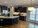 Modern kitchen featuring granite counters, stainless steel appliances, and hardwood flooring at 145 Plantation Dr, Youngsville, NC 27596