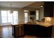 Open concept kitchen with seating area and fireplace at 145 Plantation Dr, Youngsville, NC 27596