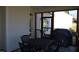Relaxing screened porch with an outdoor dining set and a ceiling fan at 145 Plantation Dr, Youngsville, NC 27596