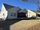 Home featuring a screened-in porch and fenced-in yard with trees at 145 Plantation Dr, Youngsville, NC 27596