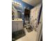 Bathroom features a vanity with storage, seashell accents, and a starfish-themed shower curtain at 1454-17 Cimarron Pkwy, Wake Forest, NC 27587