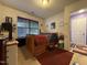 Comfortable bedroom with natural light, a large bed, and a convenient access door at 1454-17 Cimarron Pkwy, Wake Forest, NC 27587