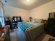 Bright bedroom features a comfortable bed, dresser, and a TV for relaxation at 1454-17 Cimarron Pkwy, Wake Forest, NC 27587