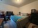 Bright bedroom features a comfortable bed, dresser, and a TV for relaxation at 1454-17 Cimarron Pkwy, Wake Forest, NC 27587