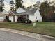 Inviting single-Gathering home with manicured lawn and blooming bushes enhancing its curb appeal at 1454-17 Cimarron Pkwy, Wake Forest, NC 27587