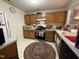 Well-appointed kitchen featuring ample cabinet space, modern appliances, and a cozy rug at 1454-17 Cimarron Pkwy, Wake Forest, NC 27587