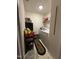 Functional laundry room featuring a washer, dryer, and storage shelves for convenience at 1454-17 Cimarron Pkwy, Wake Forest, NC 27587