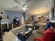 Inviting living room has a fireplace, large TV, and a comfortable sectional sofa for relaxing at 1454-17 Cimarron Pkwy, Wake Forest, NC 27587