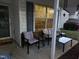 Charming porch setting with comfortable seating, ideal for relaxing outdoors at 1454-17 Cimarron Pkwy, Wake Forest, NC 27587