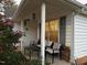 Inviting porch setting with comfortable seating, perfect for enjoying the outdoor ambiance at 1454-17 Cimarron Pkwy, Wake Forest, NC 27587