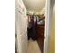 Walk-in closet provides ample storage space with organized shelving and hanging racks at 1454-17 Cimarron Pkwy, Wake Forest, NC 27587