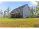 Expansive backyard with lush green grass and screened-in porch at 1520 Banks Brooke Dr, Raleigh, NC 27603