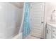 Bathroom with a tub and a shower with a patterned shower curtain at 1520 Banks Brooke Dr, Raleigh, NC 27603