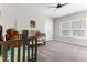 Bright bedroom with a crib and a large window at 1520 Banks Brooke Dr, Raleigh, NC 27603