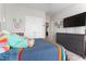 Bedroom featuring closet doors, a TV, and a dresser at 1520 Banks Brooke Dr, Raleigh, NC 27603