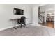 Multi-functional room with carpet flooring, offering space for a home gym, workspace, and relaxation at 1520 Banks Brooke Dr, Raleigh, NC 27603