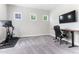 Versatile room with carpet flooring and natural light, offering space for a home gym and office set up at 1520 Banks Brooke Dr, Raleigh, NC 27603