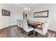Dining room featuring a dark wood table, seating for eight, and a decorative mirror at 1520 Banks Brooke Dr, Raleigh, NC 27603