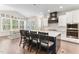 Kitchen with dark island with seating, stainless steel appliances, and hardwood floors at 1520 Banks Brooke Dr, Raleigh, NC 27603
