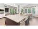 Open kitchen view to the living room with lots of counter space and farmhouse style sink at 1520 Banks Brooke Dr, Raleigh, NC 27603